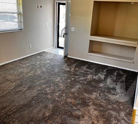 Living room with built in storage/TV