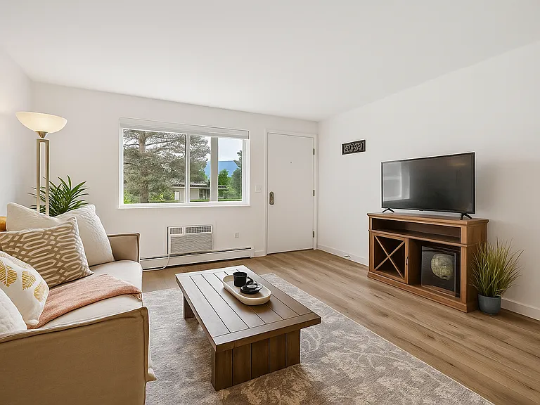 Soak in mountain views from this bright and welcoming living room _ a cozy retreat that feels both playful and peaceful the moment you arrive.