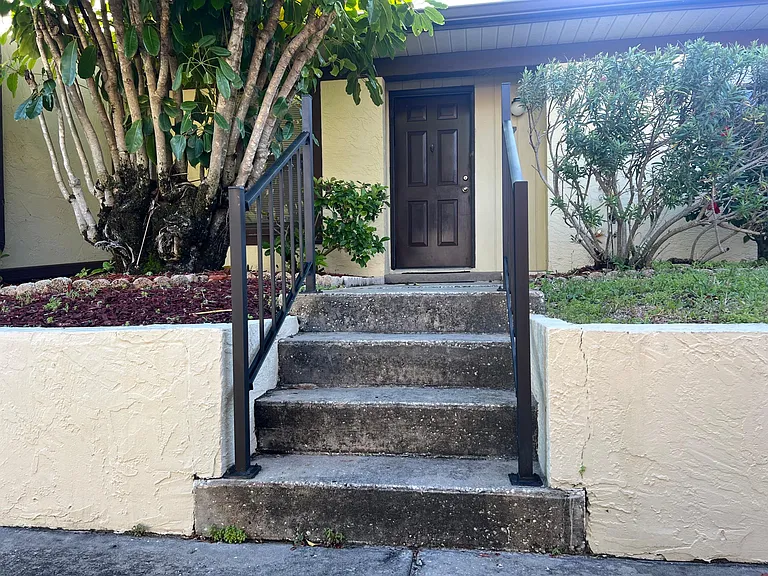 Walkway leading to front door. Just a couple of steps from parking space.