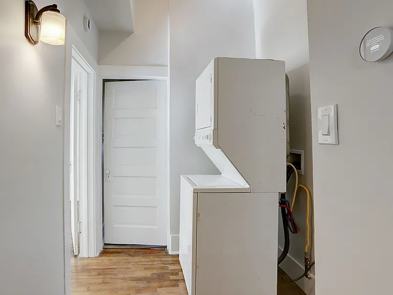 View from Kitchen looking toward Bathroom. Washer/Dryer combo located here.