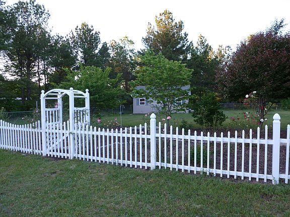 Nice fenced yard and gardens