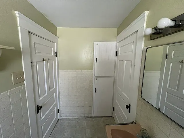 Bathroom view of restored linen closets.