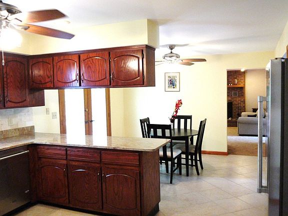 Kitchen with eating area : Kitchen has large eating area with french doors to outside deck.