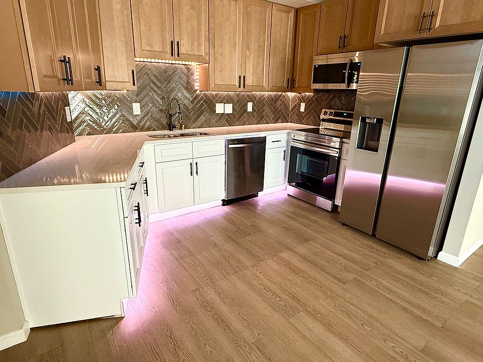 Kitchen has upper under cabinet lighting, and base cabinets with color change lighting capability