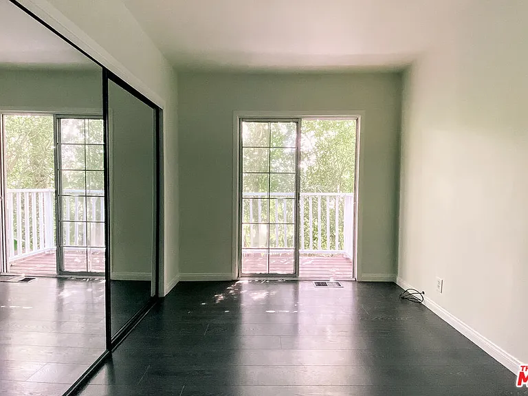 Bedroom 2 with slide to Balcony - Main Floor