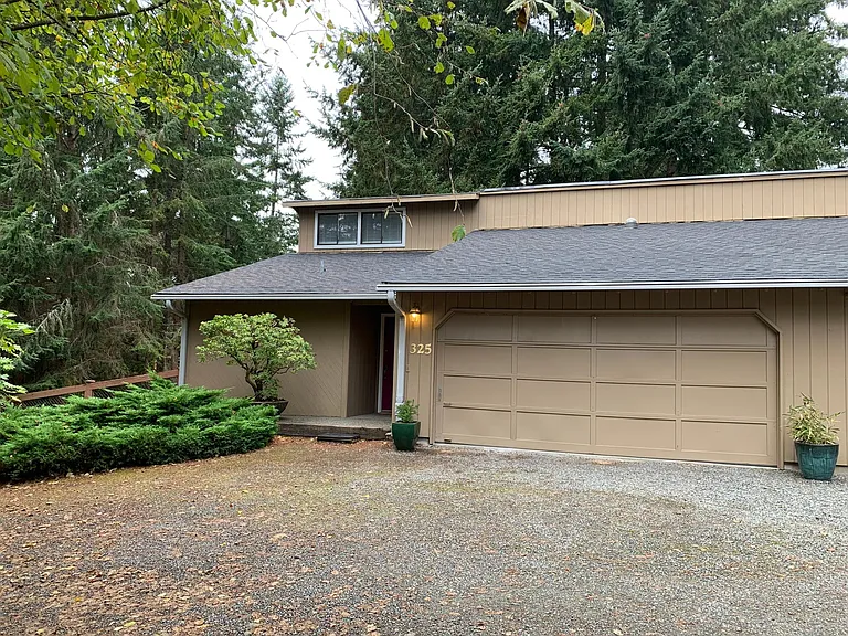 Privacy & tranquility found in this nicely remodeled left unit of the duplex. Newer roof.