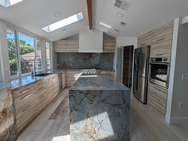 Large island provides a place to gather, cook and socialize. Kitchen is tailored to allow efficient and ergonomic cooking.

Large and powerful hood available (can clear out smoke from the kitchen area in minutes).