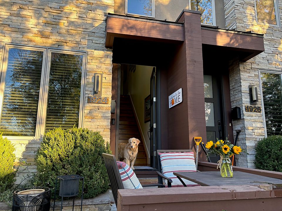 Front of Townhome with cozy bistro set to enjoy a morning cup of coffee or watch the sunset