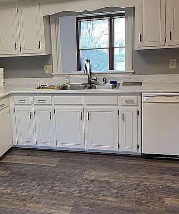 Renovated kitchen, countertops of powdered granite and professionally restored and painted cabinets. Luxury LVP flooring is fully water proof and scratch proof...easy to care for. New microwave and dishwasher