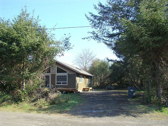 Cabin sits nestled off the street.