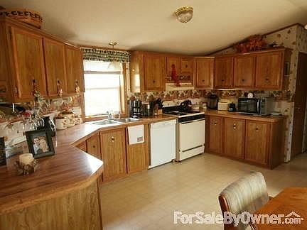 Kitchen with Dish Washer and Stove. Lots of counter and Cabinet space.
