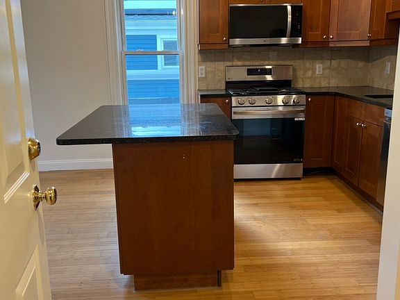 Entry into unit, Kitchen straight ahead. Living room & Alcove to the left. Hallway to right to bathroom, laundry closet and bedrooms.