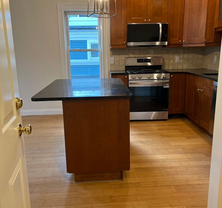 Entry into unit, Kitchen straight ahead. Living room & Alcove to the left. Hallway to right to bathroom, laundry closet and bedrooms.