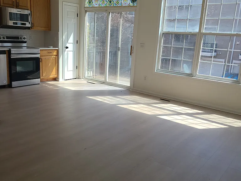 Open kitchen with balcony and casual space for dining and entertainment