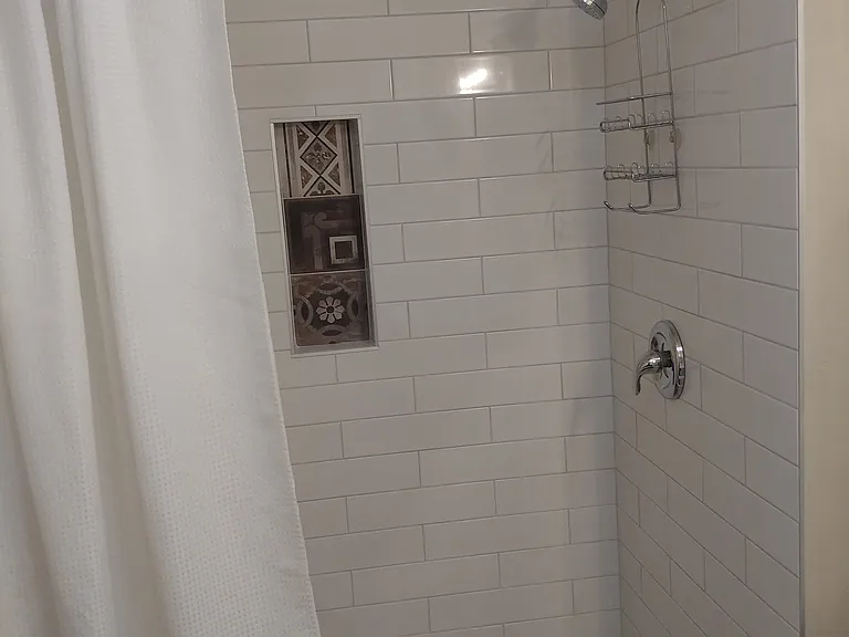 Large walk-in, tiled shower.
