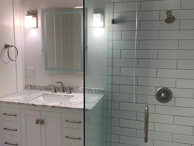Master bathroom with walk in shower, sink and toilet
