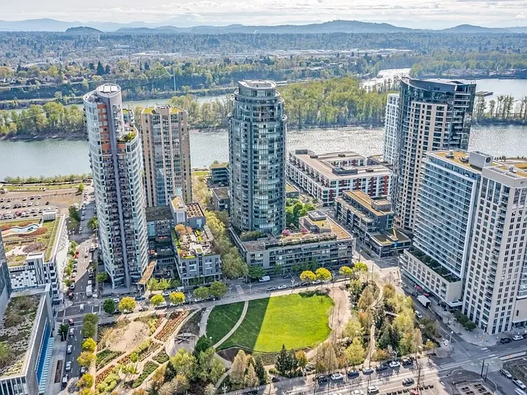 Iconic John Ross building in Portland's South Waterfront, surrounded by parks, riverfront trails, and city conveniences.