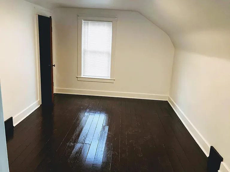 Bedroom #2 with freshly painted hardwood floor