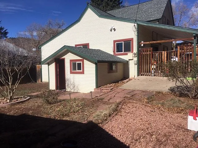 Backyard area with door to basement.