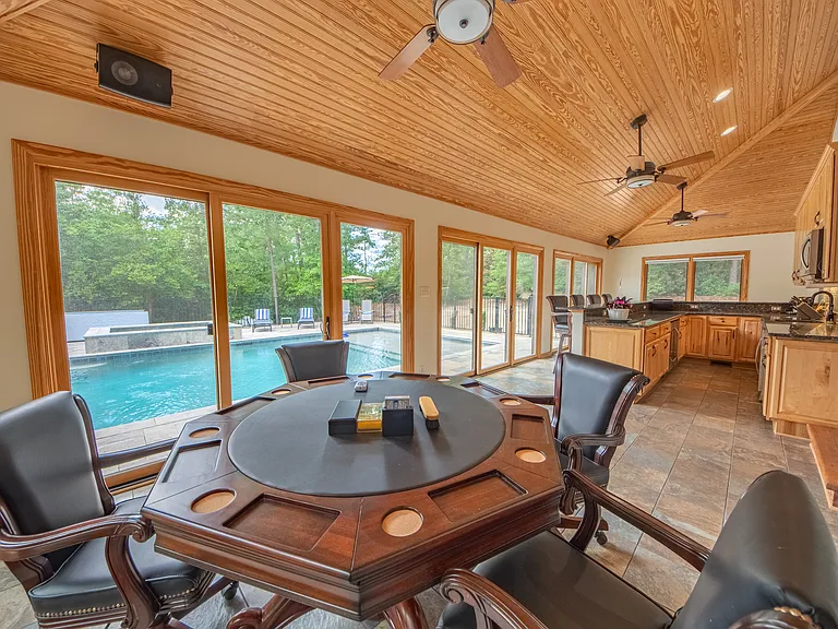 Pool room with game table and bar.