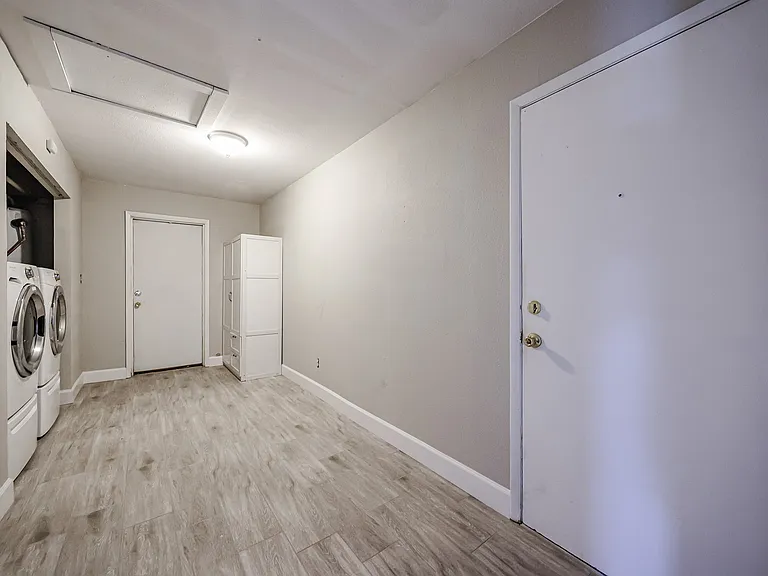 Large laundry room with washer and dryer