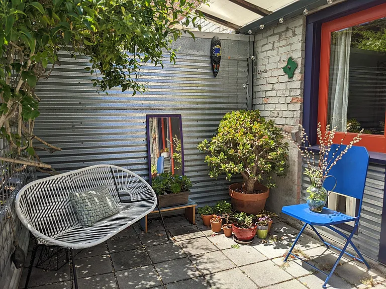 Sitting area under jasmine in private patio