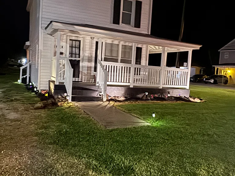 Spacious yard beautiful home at night