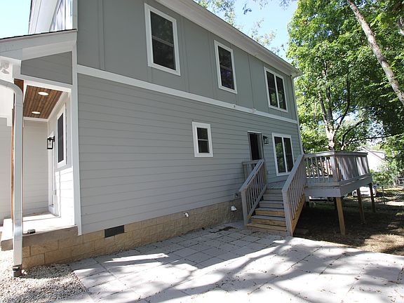 Private back deck with shady trees