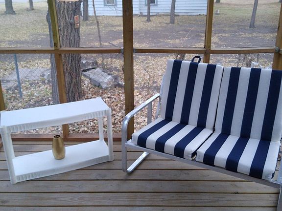 Screened in porch with patio furniture to avoid Great Bend mosquitoes..Good lord this is much needed.