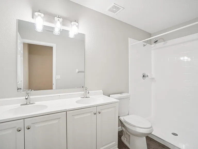 Master suite features a spacious double vanity and updated fixtures_perfect for shared morning routines