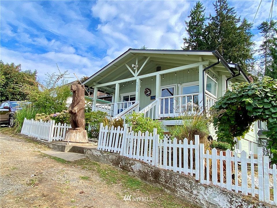 The big brown bear house up on the hill overlooking Sinclair Inlet.