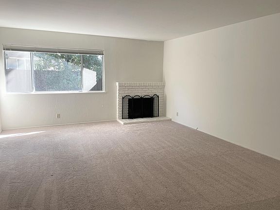 Spacious living room with a real wood fireplace