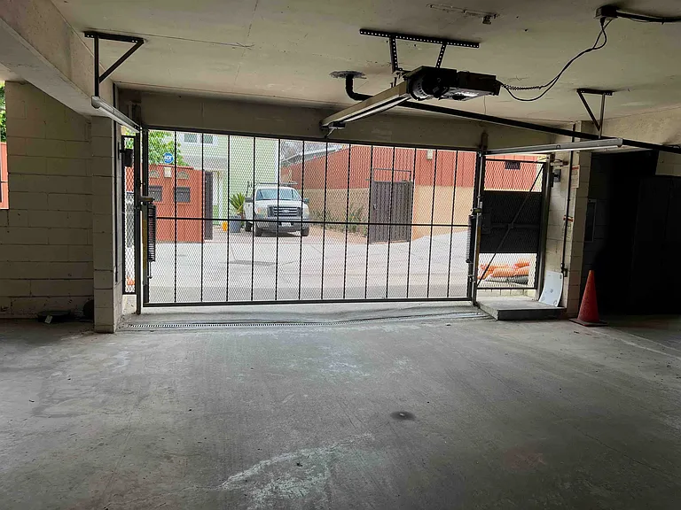 Gated garage door. Also, the neighborhood is quiet and safe and there is ample parking - many tenants have 2 cars with no problem. Just plan for major events such as the Greek fest, marathon, pride parade.