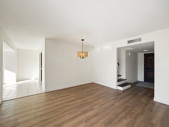 Great room dining area; view of stairs and front door