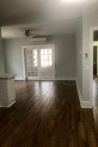 Living room area with french doors leading to additional space