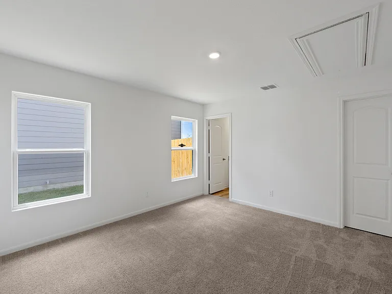 The master bedroom has its own walk-in closet.