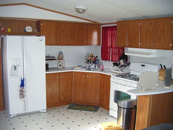 Kitchen includes Amana Convection/Bake Stove and Side by Side Fridge