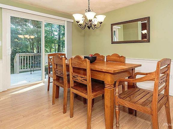 Dining room with view of private deck and Merrimac River