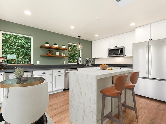 Main floor open living and dining with 1/2 bath.