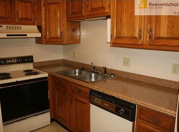 BRAND NEW COUNTERTOPS installed.  Notice plenty of cabinet stora