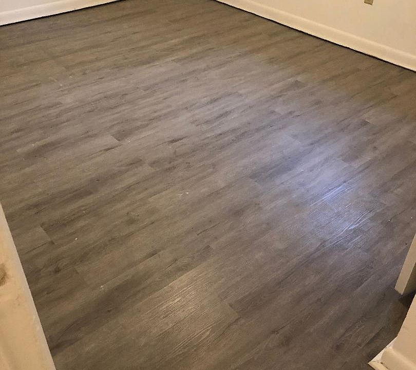 Small Bedroom with new Laminate wood Flooring.