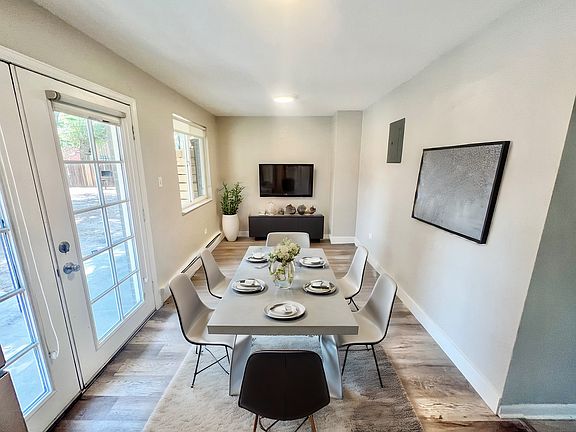 Experience the elegance of this chic dining and living space designed for modern comfort.