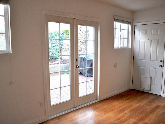 Newly installed French doors (and additional doggy door for the additional side entrance) allows for added flexibility and space! This bedroom also has its own closet with a door as well.