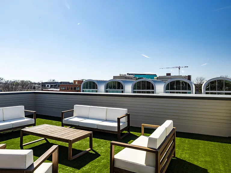 Enjoy your private patio on the 3rd floor. There is plenty of seating either under the pergola or not, there is a pool table that doubles as a table, TV, fans, and corn hole.