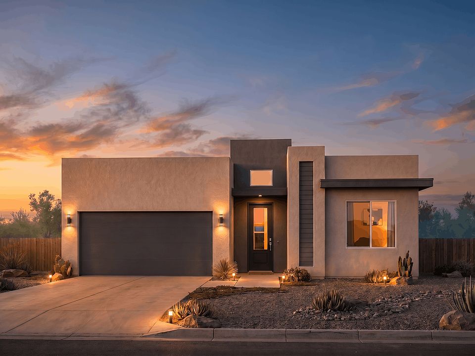 Modern single-story house with a flat roof, smooth beige walls, large windows, and a dark garage doo