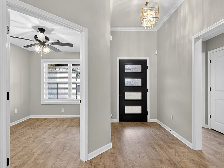 Front entry area, office is on the left, hallway on the right gives access to 1 bedroom, 1 bathroom, storage closet, and master