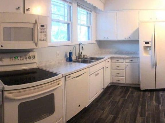 New tile floor, new countertops, butcher block island top, new sink with Mohen pullout sprayer.