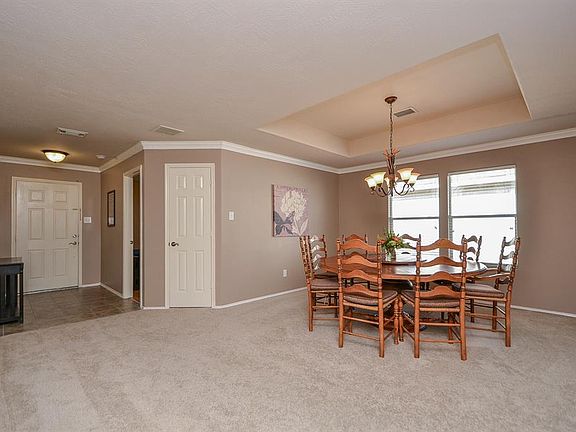 Imagine your friends and family gathered around the table in this formal dining room.