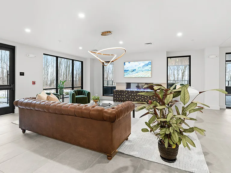 Lounge with Fireplace & Frame TV for community use.