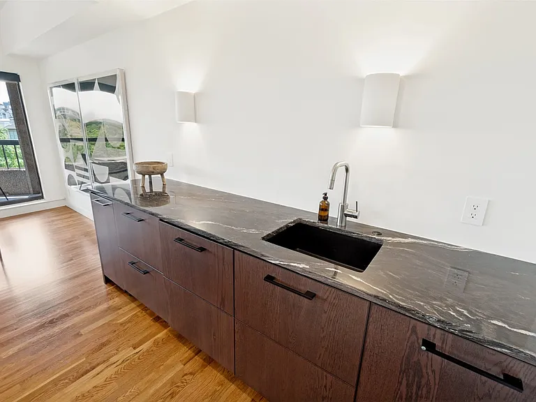 Along with great counter space, the food prep area has: a U-line 15 Wine Captain wine cooler, soft-close pull-out drawers, the dishwasher, an under-sink water filtration system and a swing out blind corner cabinet.